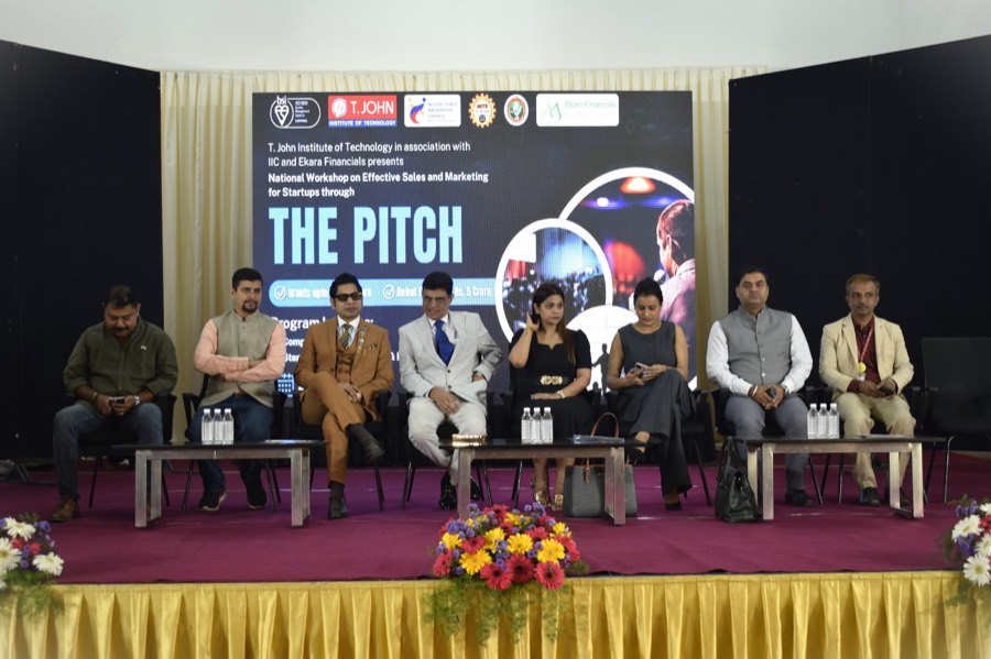 Panel of guests on stage at T. John Institute of Technology during THE PITCH workshop