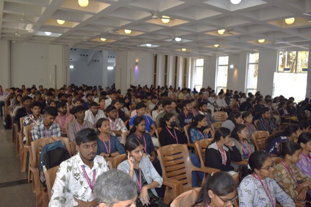 Students and faculty seated in the auditorium during a workshop