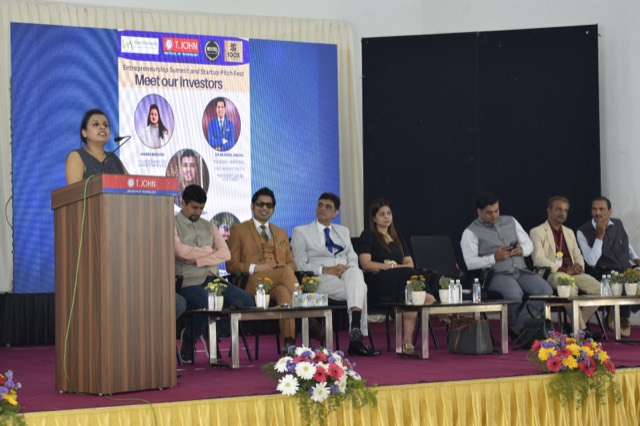 A host introduces the investors at the entrepreneurship summit and startup pitch fest