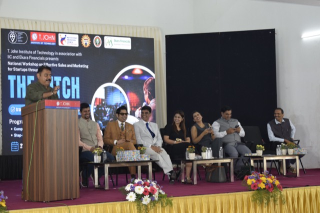 A speaker at the podium during an afternoon session