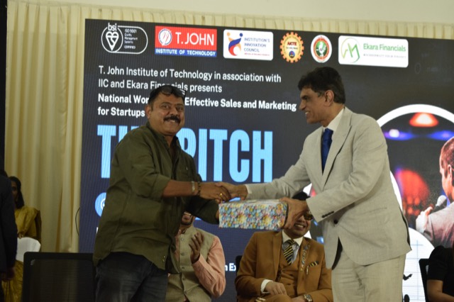 A guest is felicitated with a memento on stage