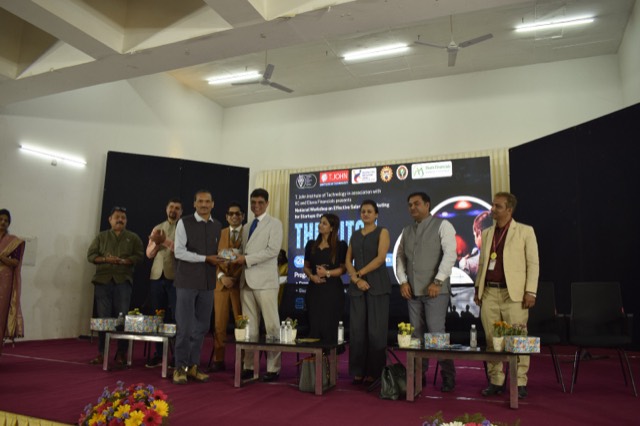 Guests and organisers gather on stage at the conclusion of the workshop