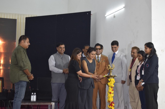 Guests light the ceremonial lamp to inaugurate the workshop